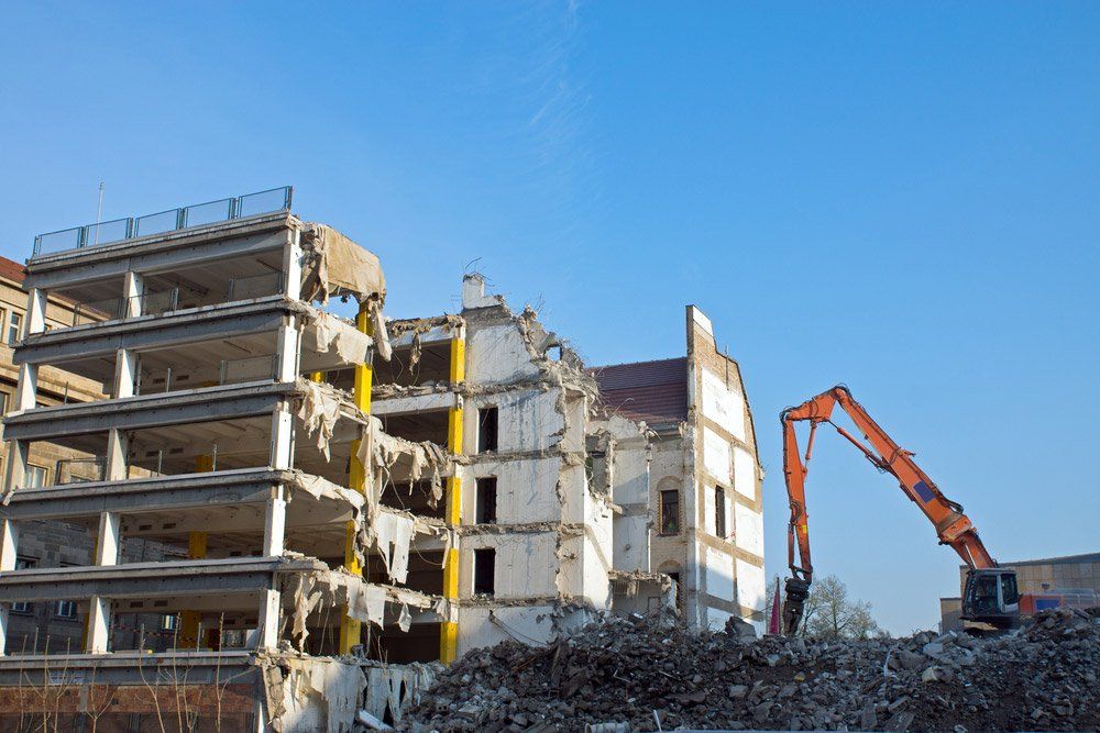 Demolition Of A Building With Excavator — Allcoast Group Demolition in Sunshine Coast, QLD