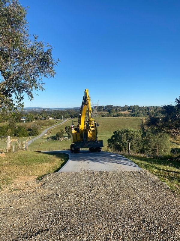 A digger performing a residential demolition on a Sunshine Coast house — Allcoast Group Demolition Contractors