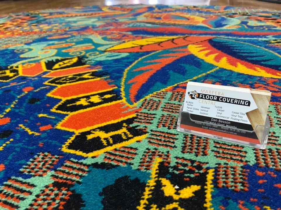Colorful Patterned Carpet With A Business Card — Mareeba Floor Covering Centre in Mareeba, QLD