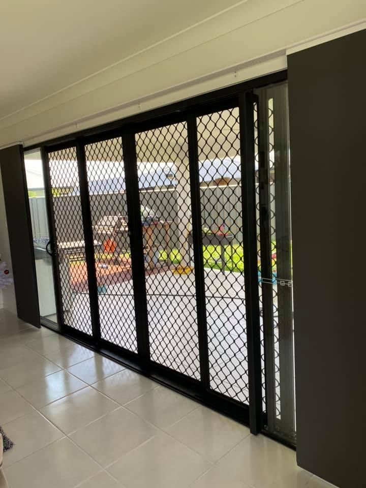 Sliding Glass Doors With Black Security Screens — Mareeba Floor Covering Centre in Mareeba, QLD