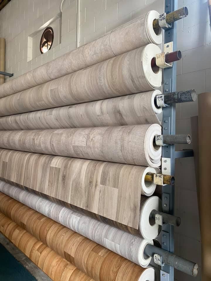 Rows Of Rolled Flooring Samples, In Various Wood-grain Patterns — Mareeba Floor Covering Centre in Port Douglas, QLD