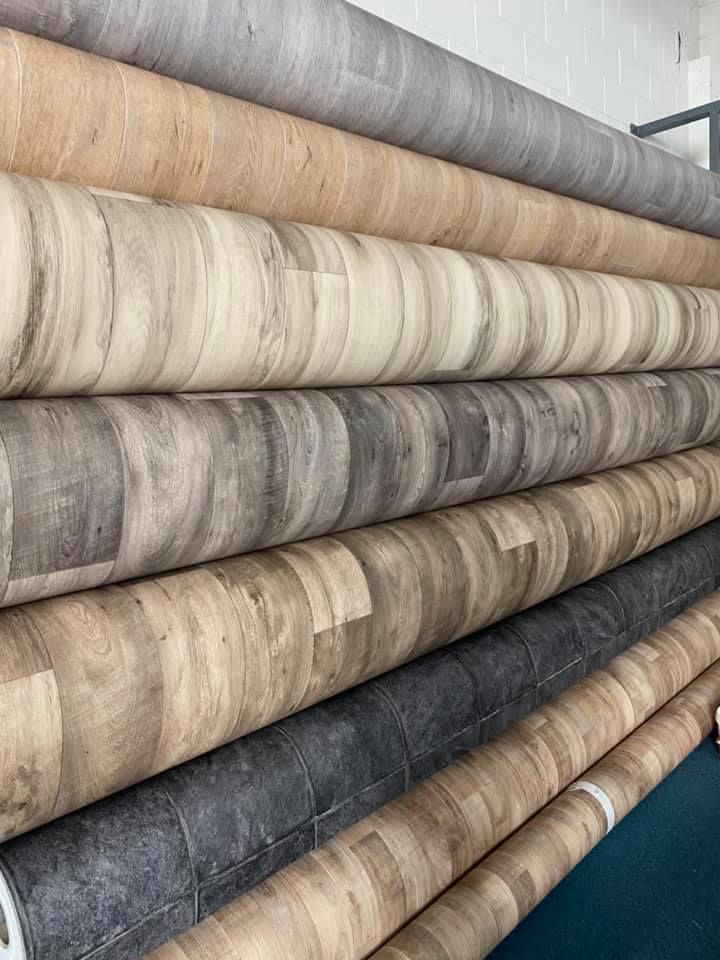 Rolls of wood-look vinyl flooring — Mareeba Floor Covering Centre in Mareeba, QLD