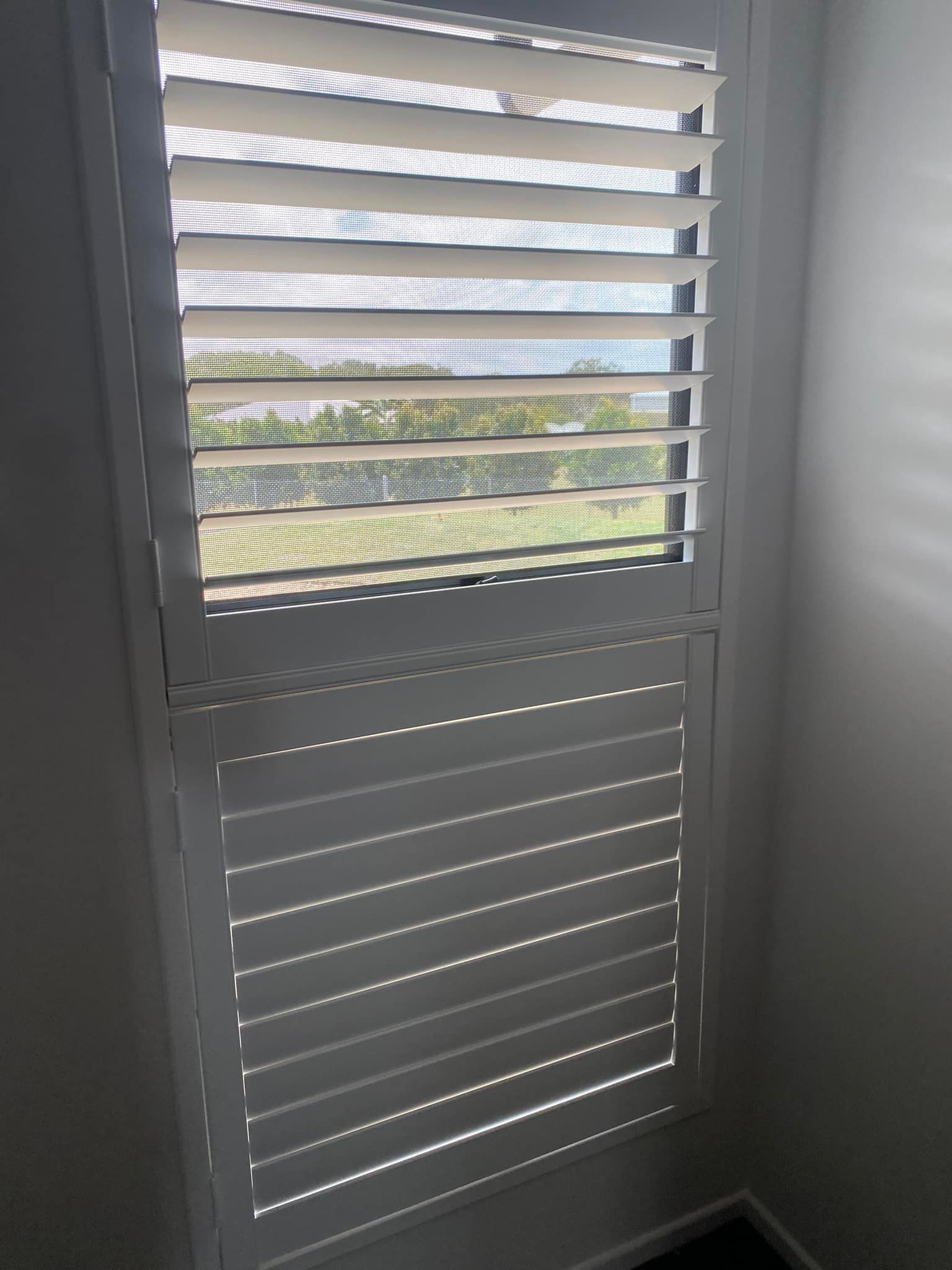 White Window Shutters With Partially Open Louvers, Casting Shadows — Mareeba Floor Covering Centre in Cassowary Coast, QLD