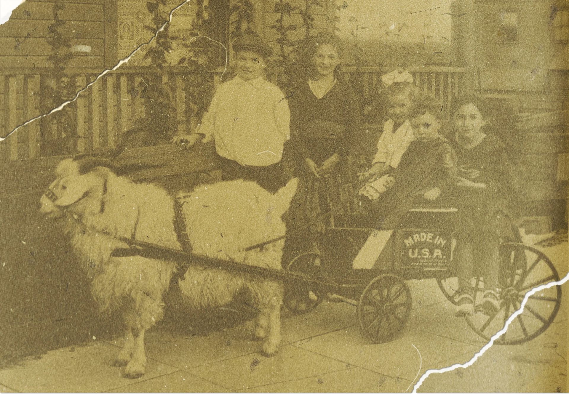 Three people sit in a horse-drawn cart in front of a stone building.