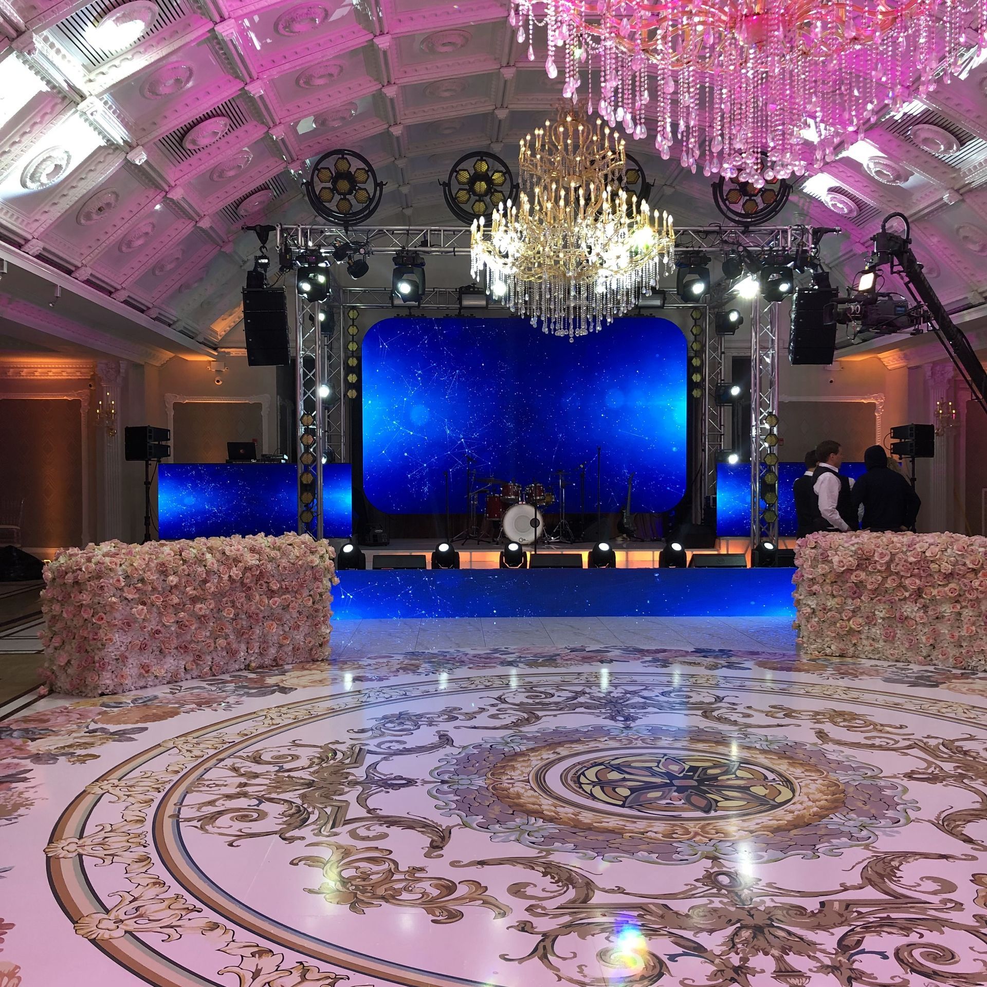LED Video Wall and A large ballroom with a dance floor and a chandelier.