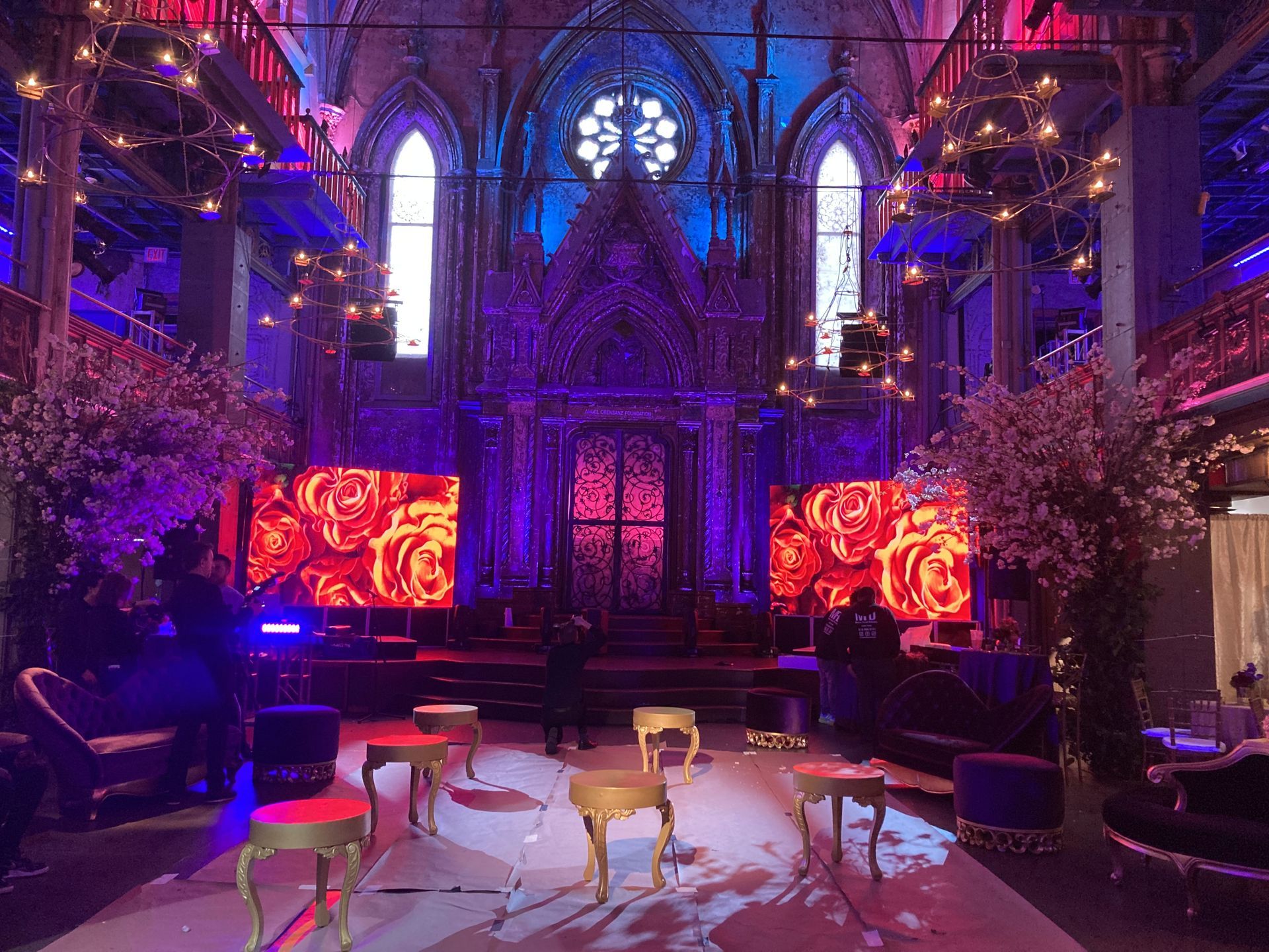 LED Video Wall and The inside of a church is lit up with purple and blue lights.