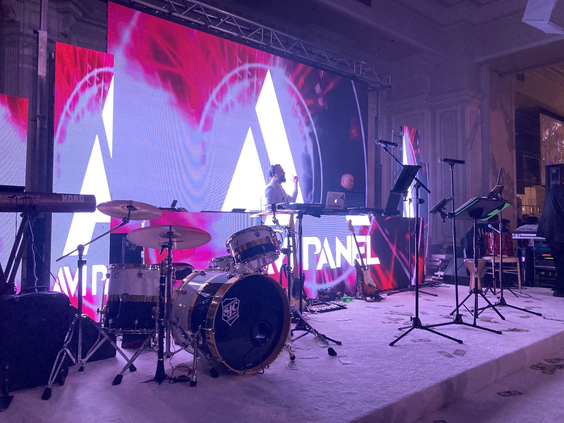 LED Video Wall and A drum set is sitting on a stage in front of a large screen.