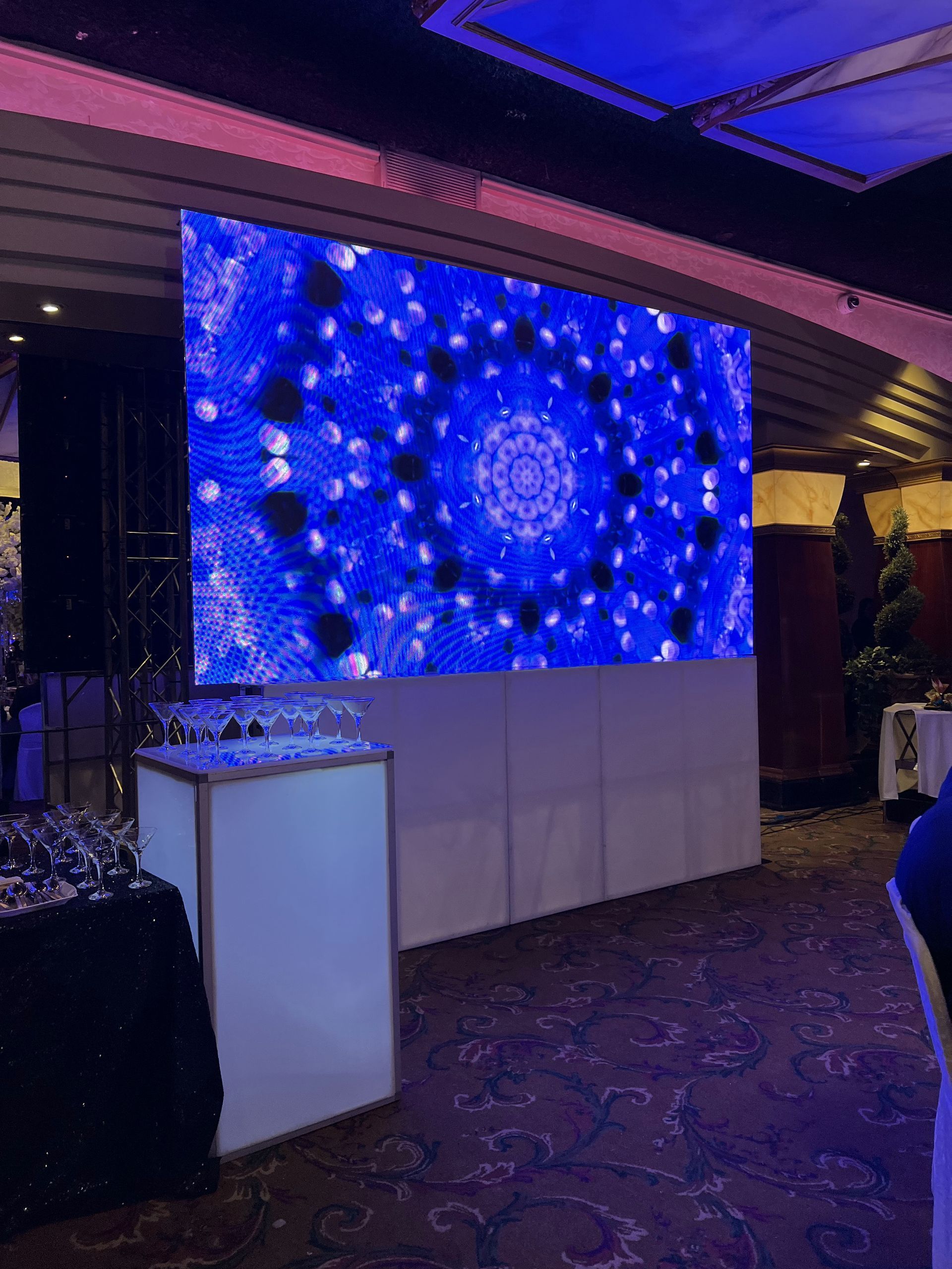 LED Video Wall and A large screen is hanging on the wall of a room.
