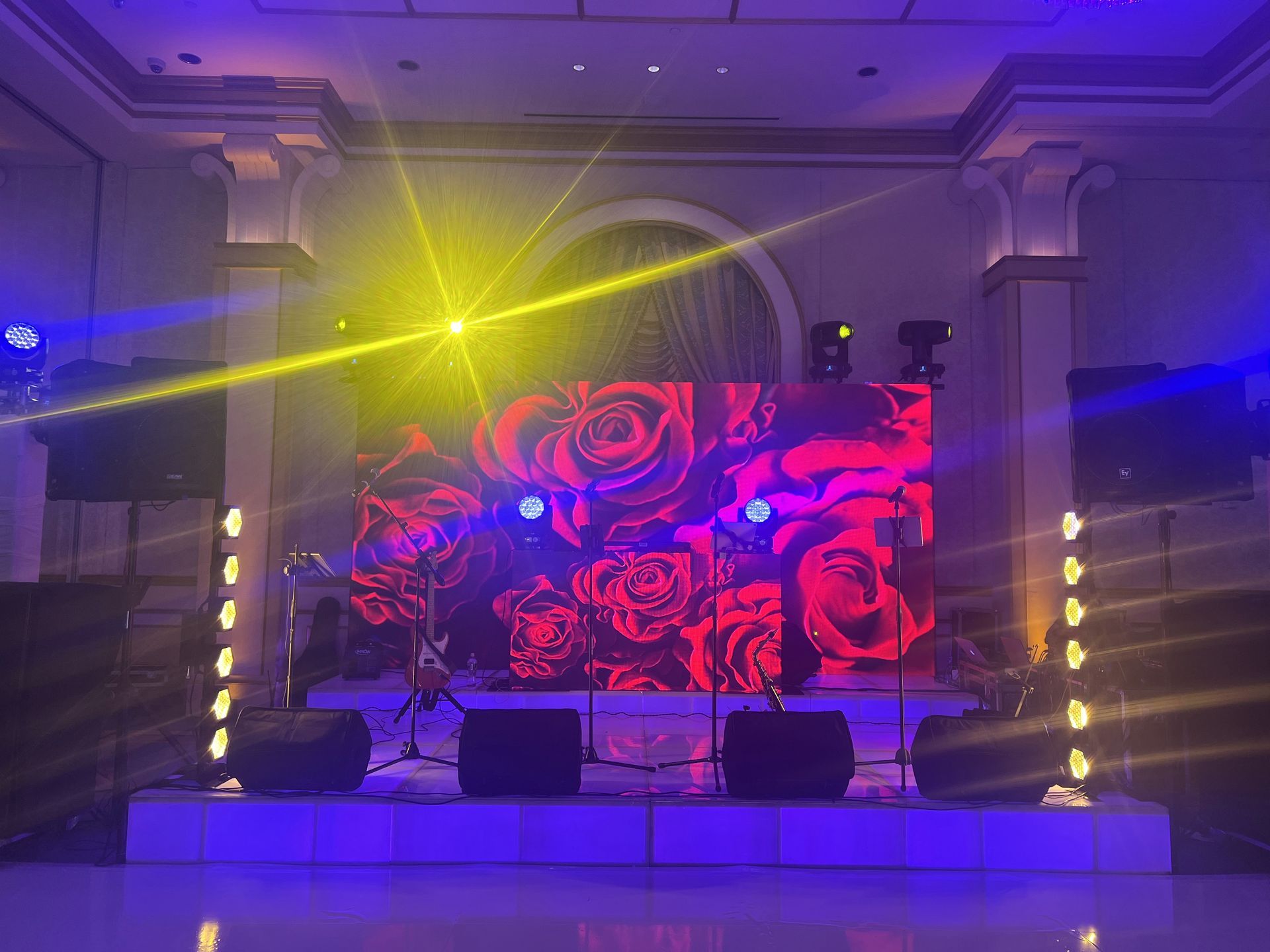LED Video Wall and A stage with a large screen and a lot of lights on it.