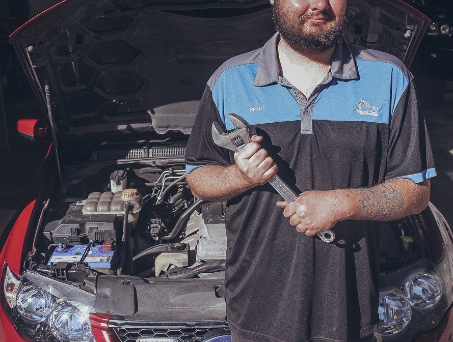 Mechanic Holding An Adjustable Wrench — Roadside Assistance in Berkley Vale, NSW