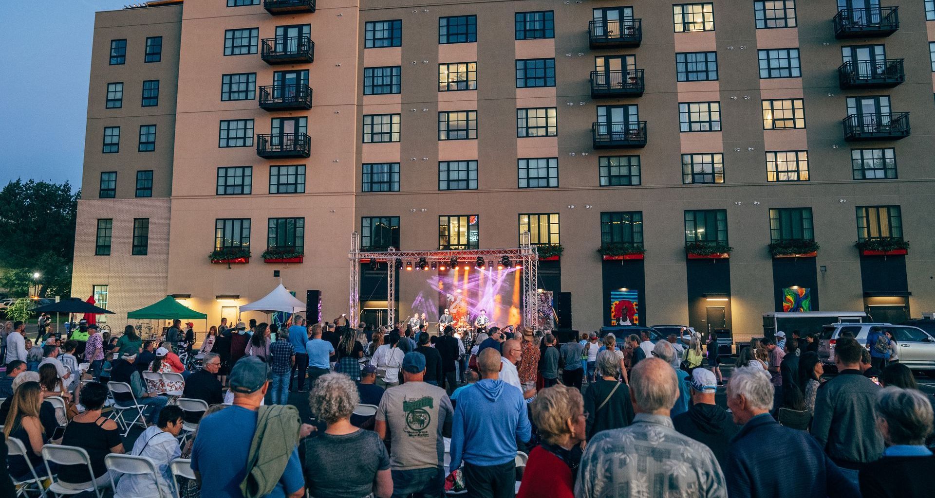 Exterior photo of people watching tv outside