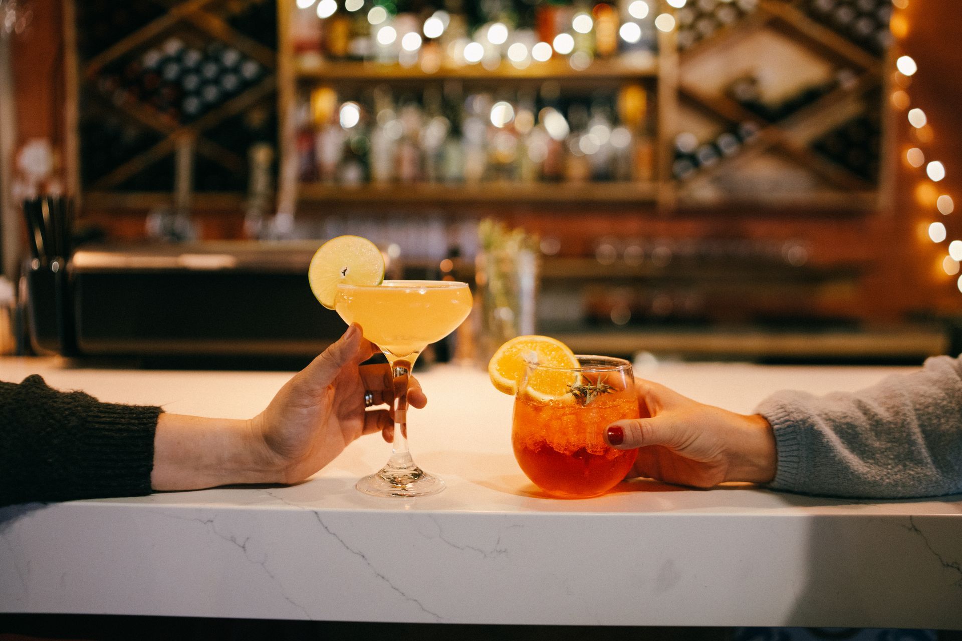Friends enjoying cocktails at Poppi's restaurant at 5th Street Public Market