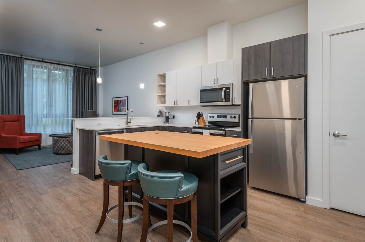 photo of kitchen with blue bar stools