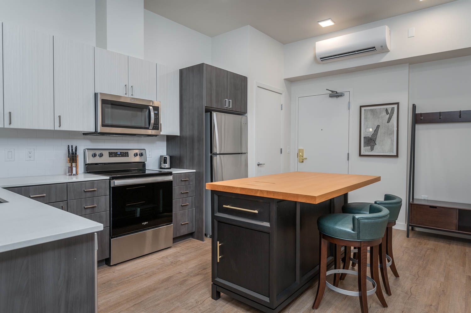 photo of kitchen with blue bar stools