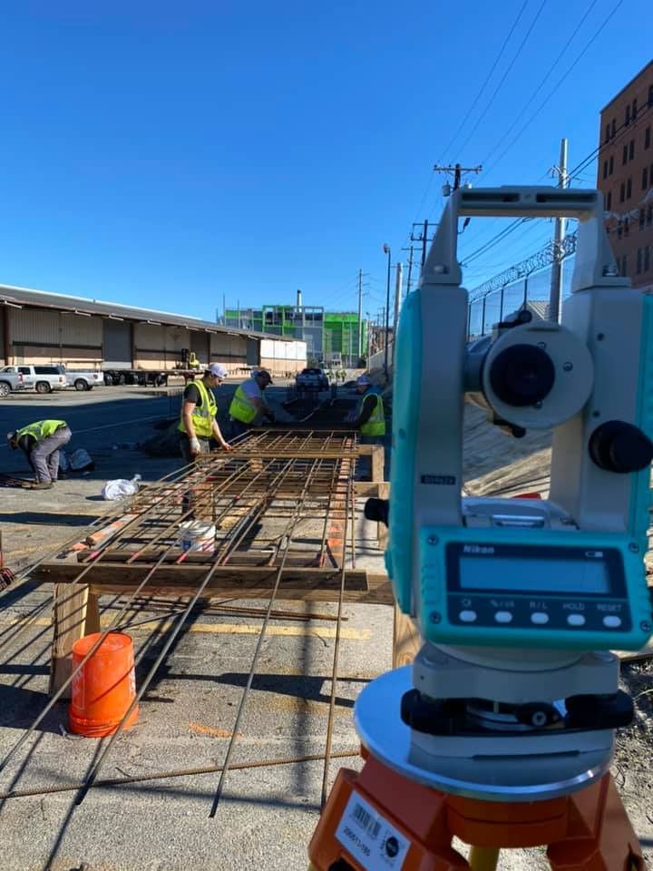 A group of construction workers are working on a construction site.