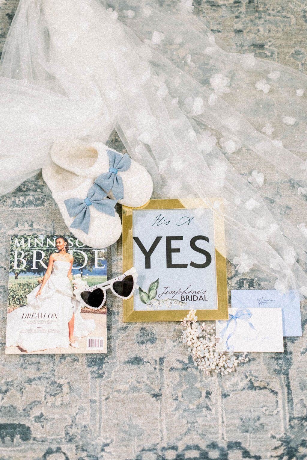 Wedding-themed scene with slippers, a framed 