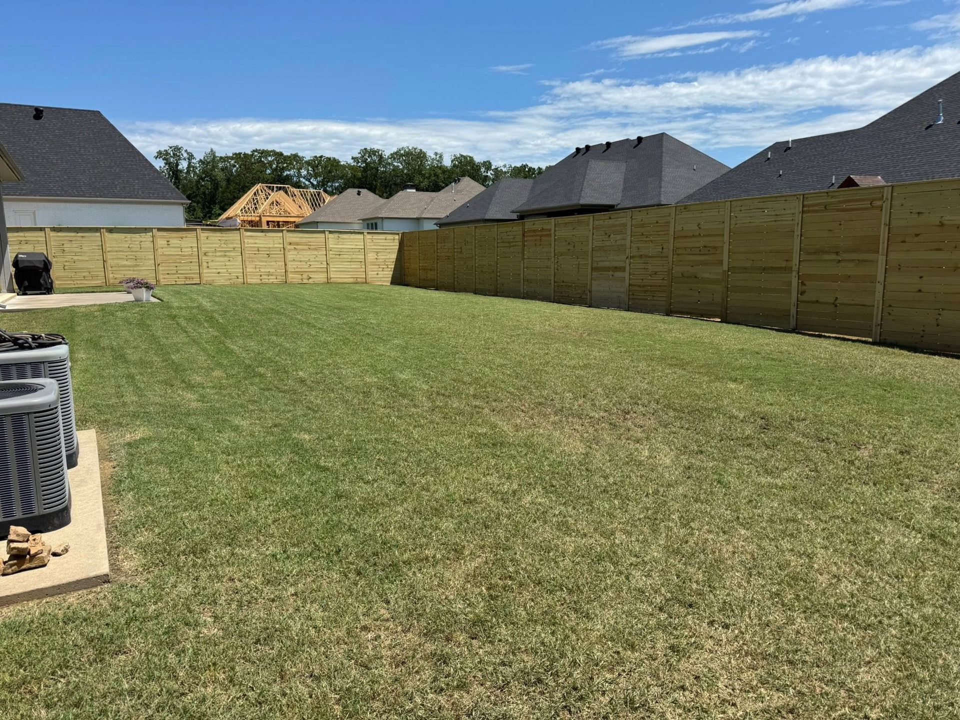 Photo of wood fence installation backyard privacy fence by J&S Fence in Conway, AR