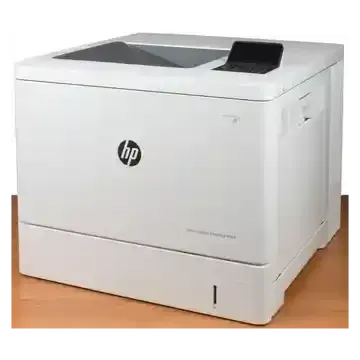 A white hp printer is sitting on top of a wooden table.