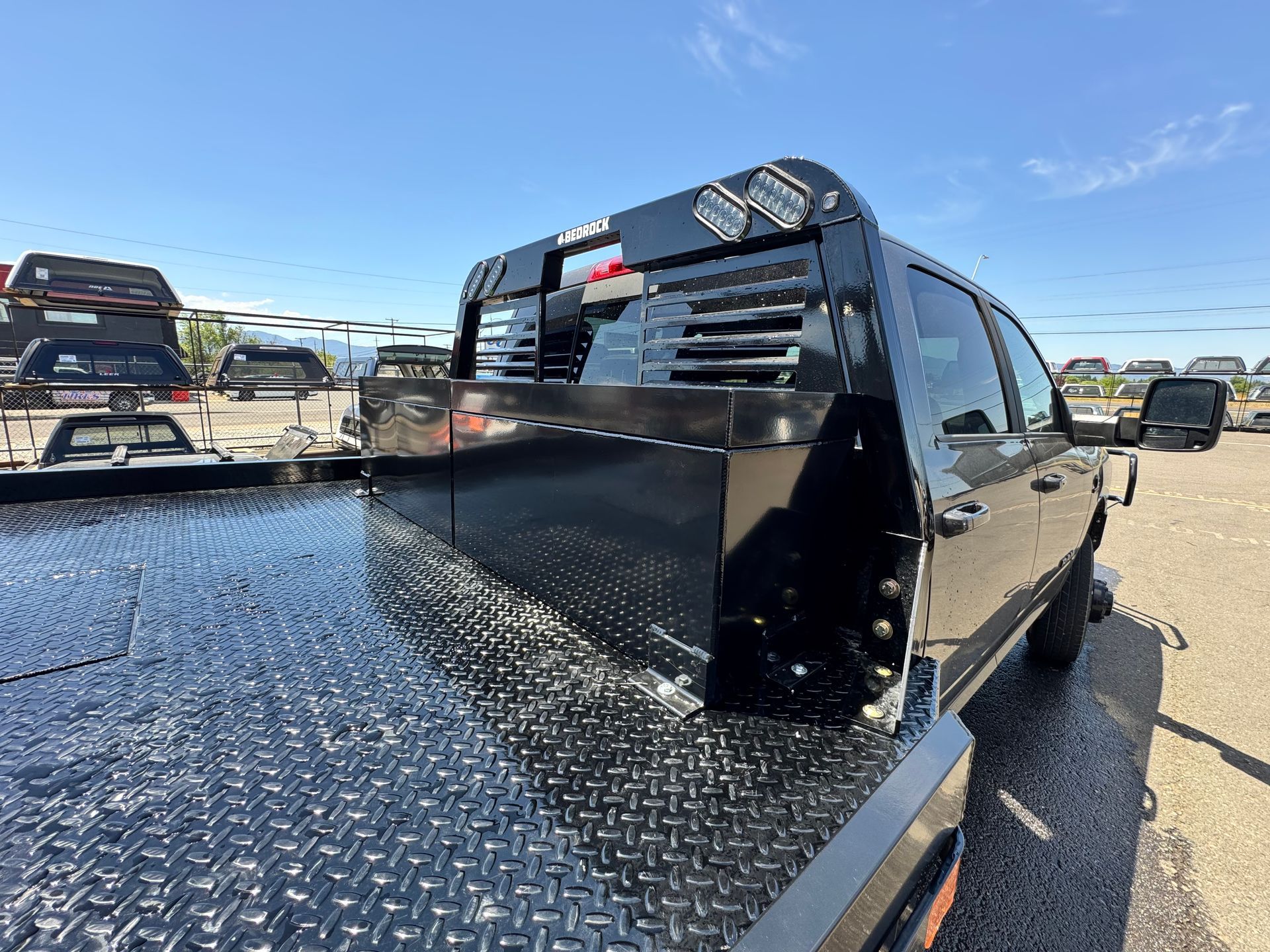 Custom welded storage boxes and headache rack on a flatbed truck, built by TDS Fabrication