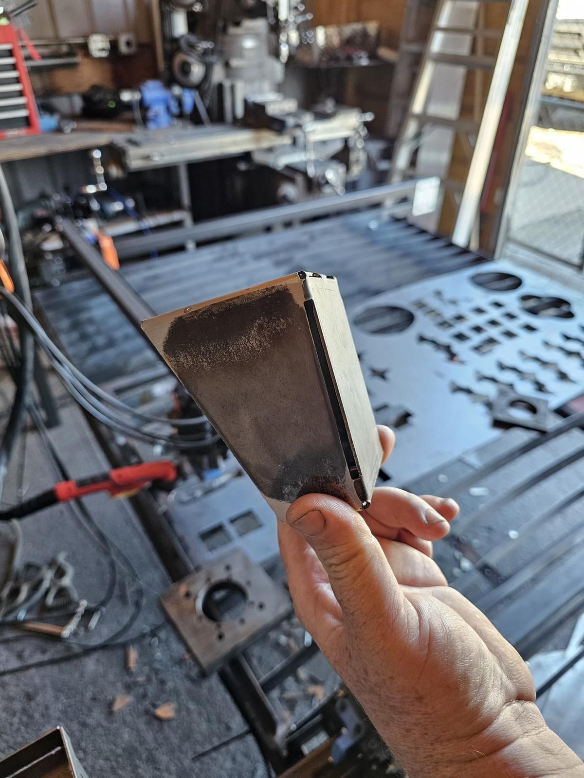 CNC plasma-cut and press-brake-formed steel part