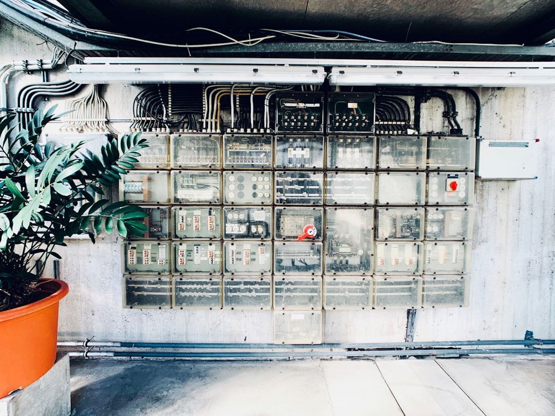 alt: Residential electrical panel with circuit breakers for EV charging - 240 volt charger installation