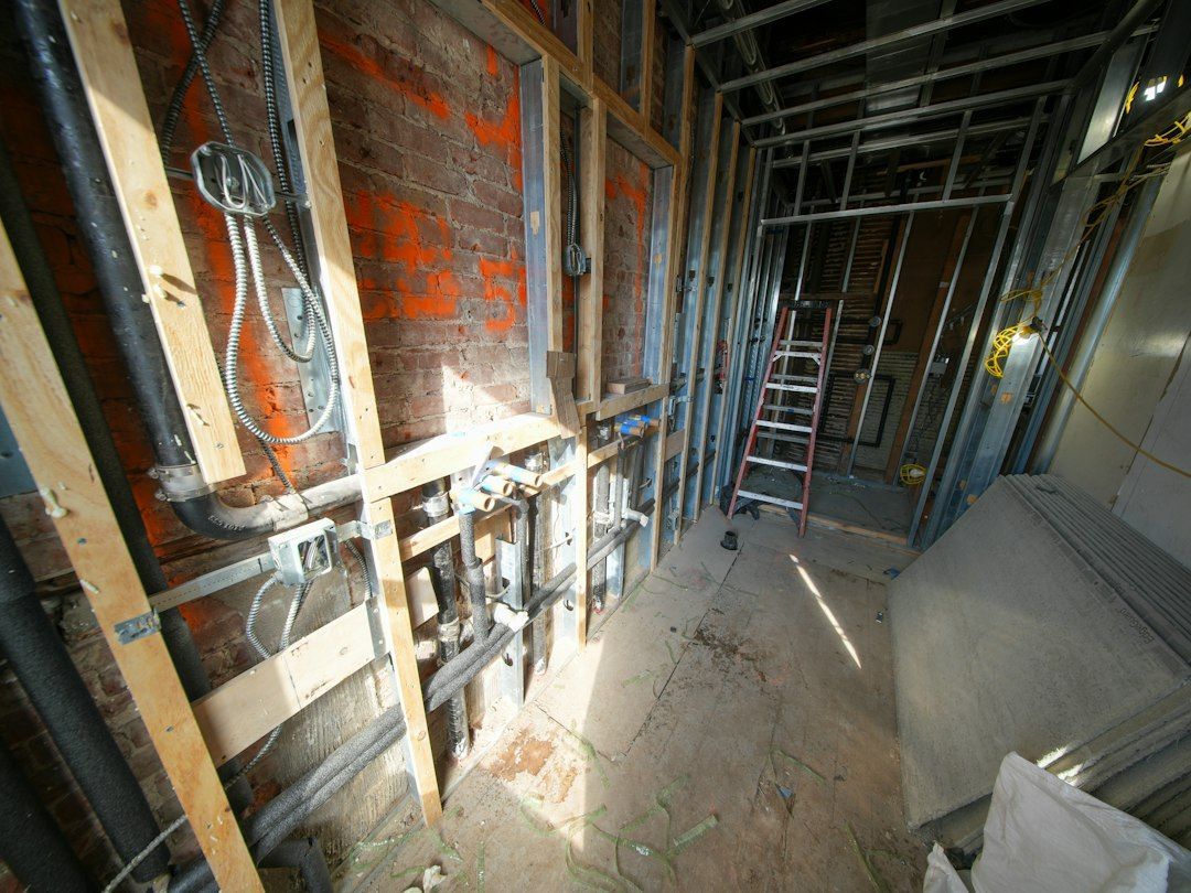 plumber inspecting home plumbing