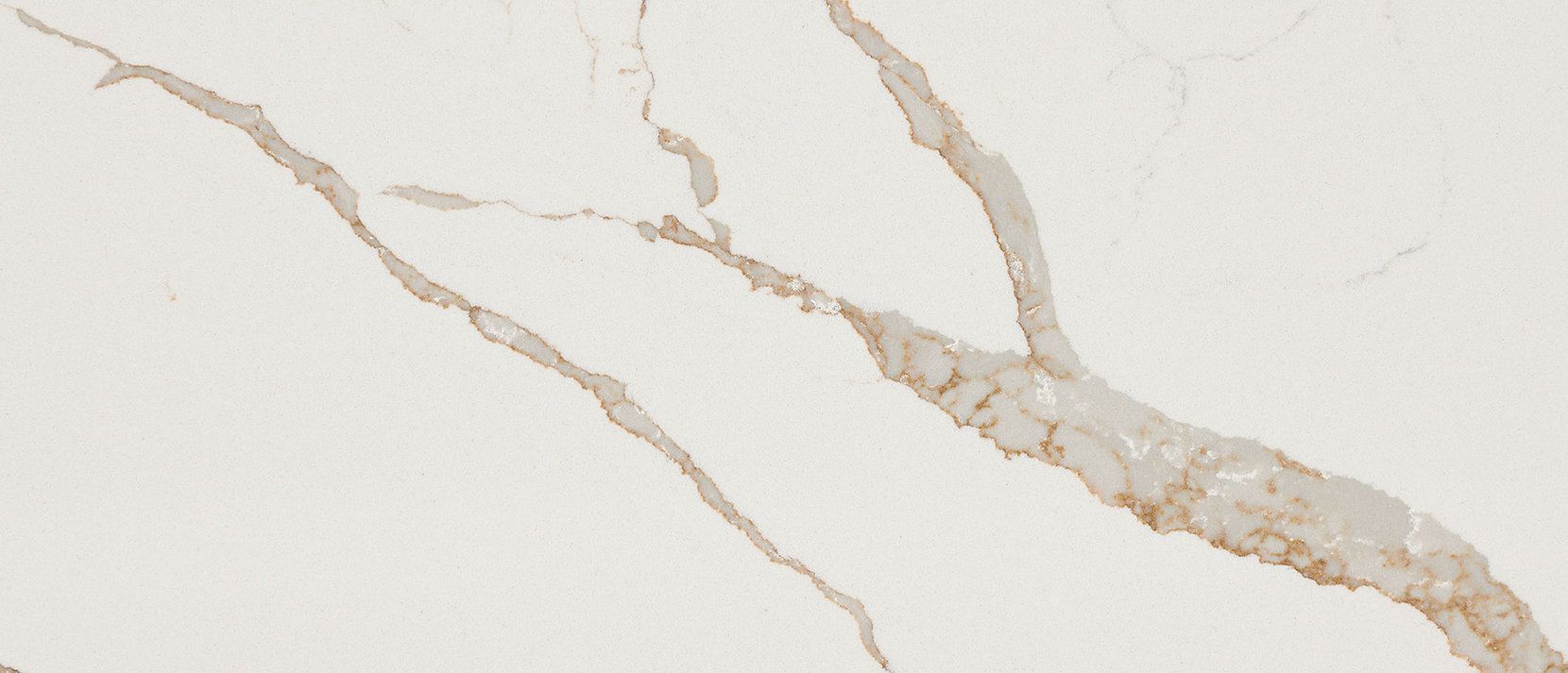White countertop with golden-brown veining, simulating marble.