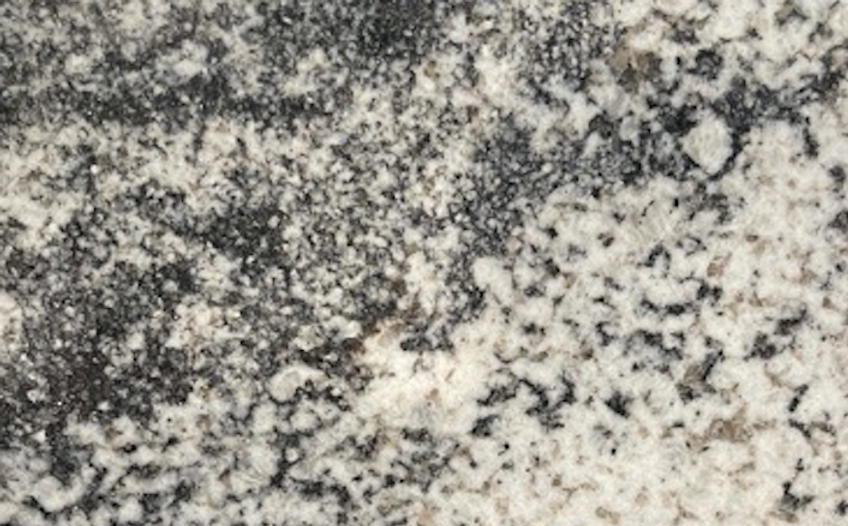 Granite countertop with speckled black, gray, and white patterns.