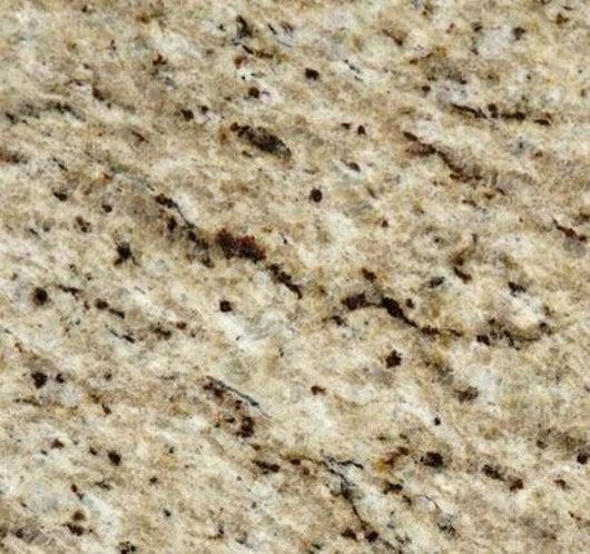 Beige and brown granite countertop with dark speckles and varied veining.