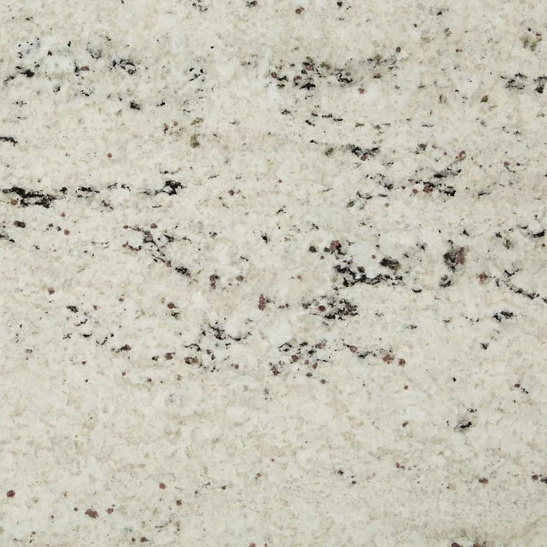 White granite countertop with black and brown speckles and veining.