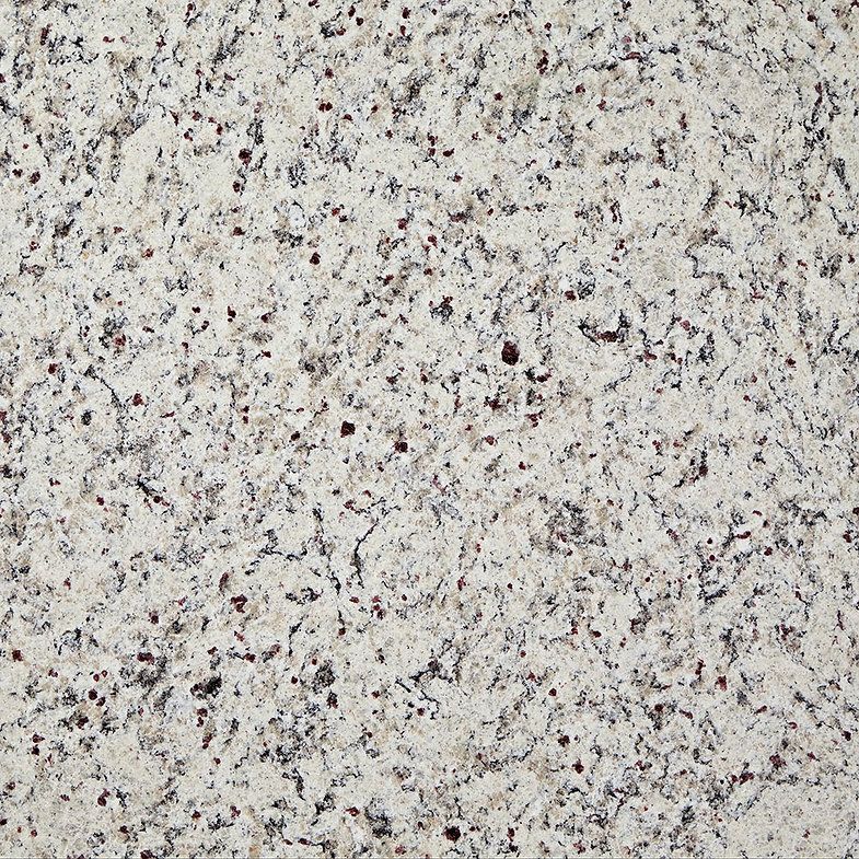 Close-up of a white granite countertop with black and gray speckles.