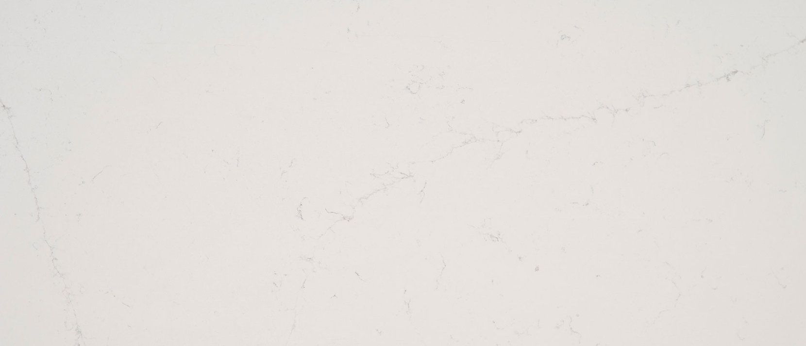 Close-up of white marble texture with subtle gray veining.