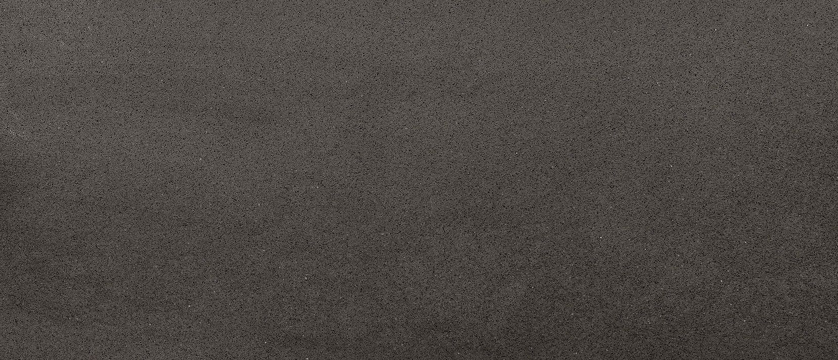 Close-up of a textured, dark gray surface.