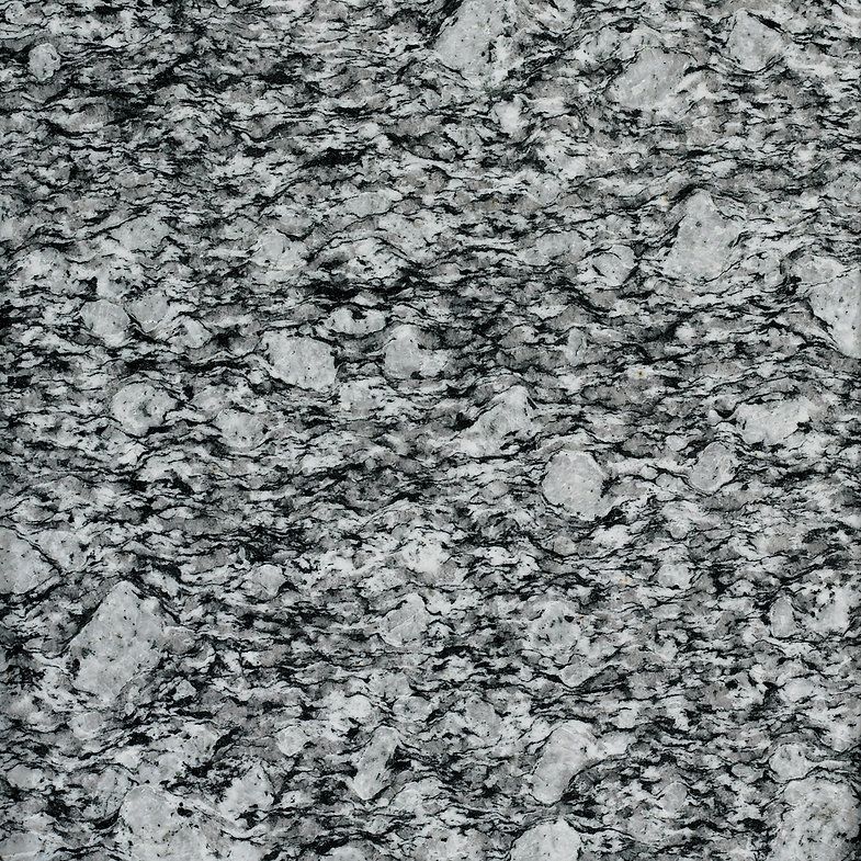 Gray granite countertop with speckled black and white patterns.