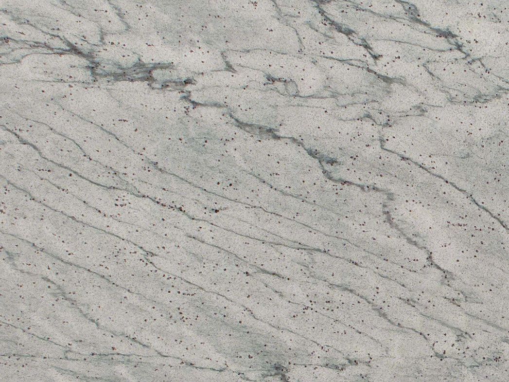 White granite surface with gray veining and small dark spots.