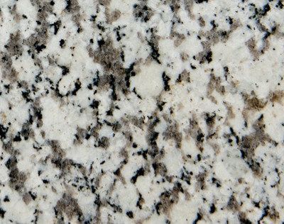 White granite countertop with black and gray speckles.