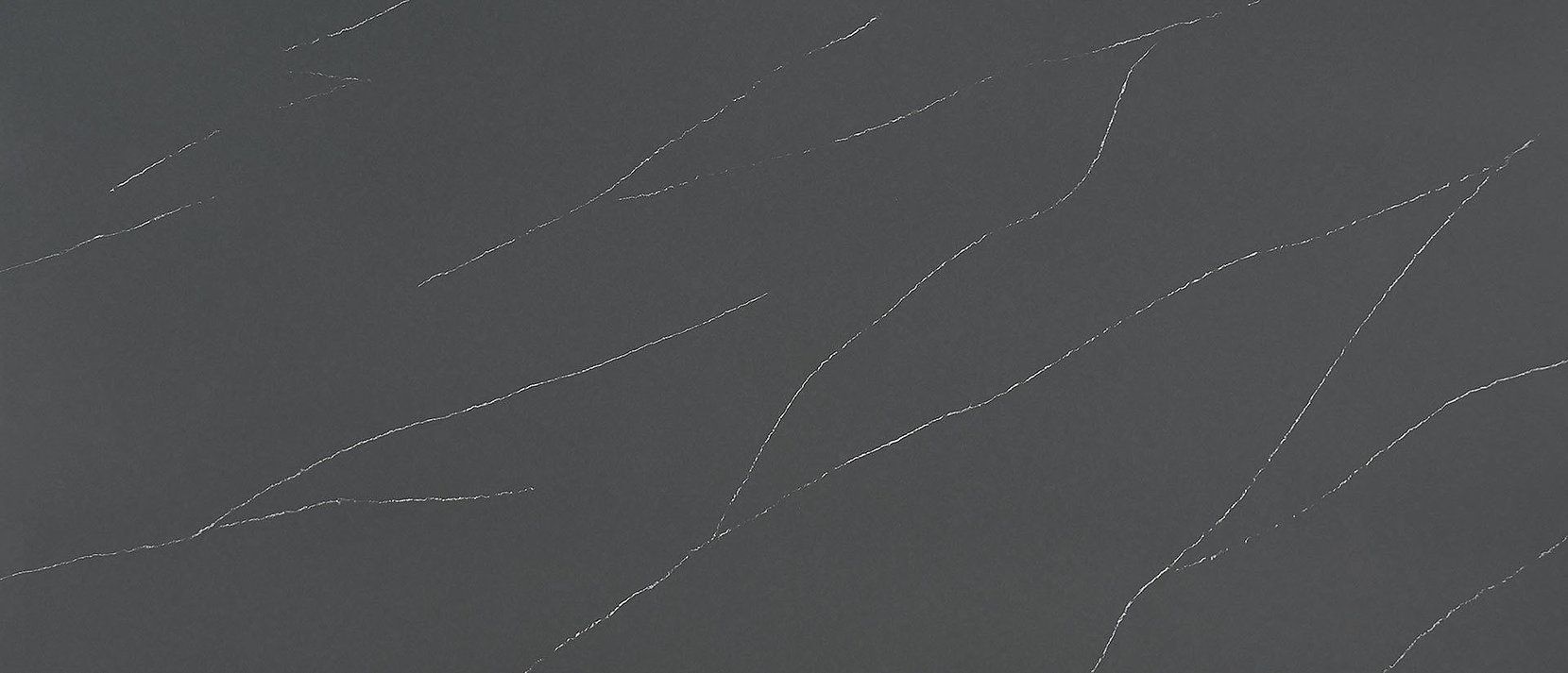 Gray background with sparkly, irregular diagonal lines.