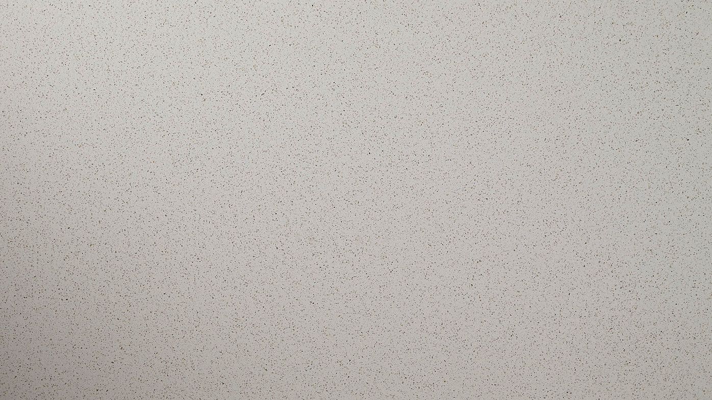 White speckled surface.