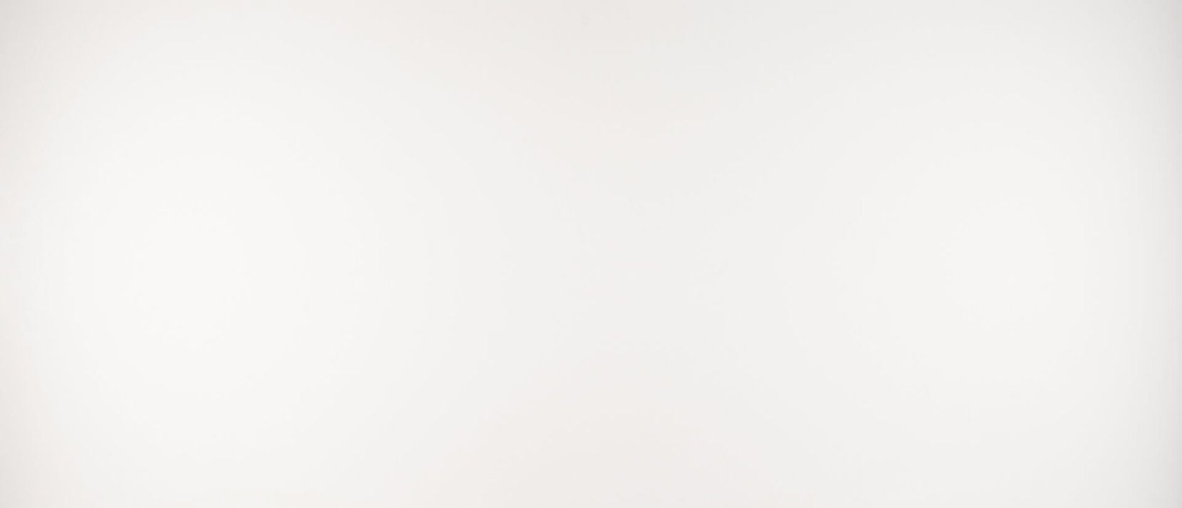 Off-white, softly lit background.