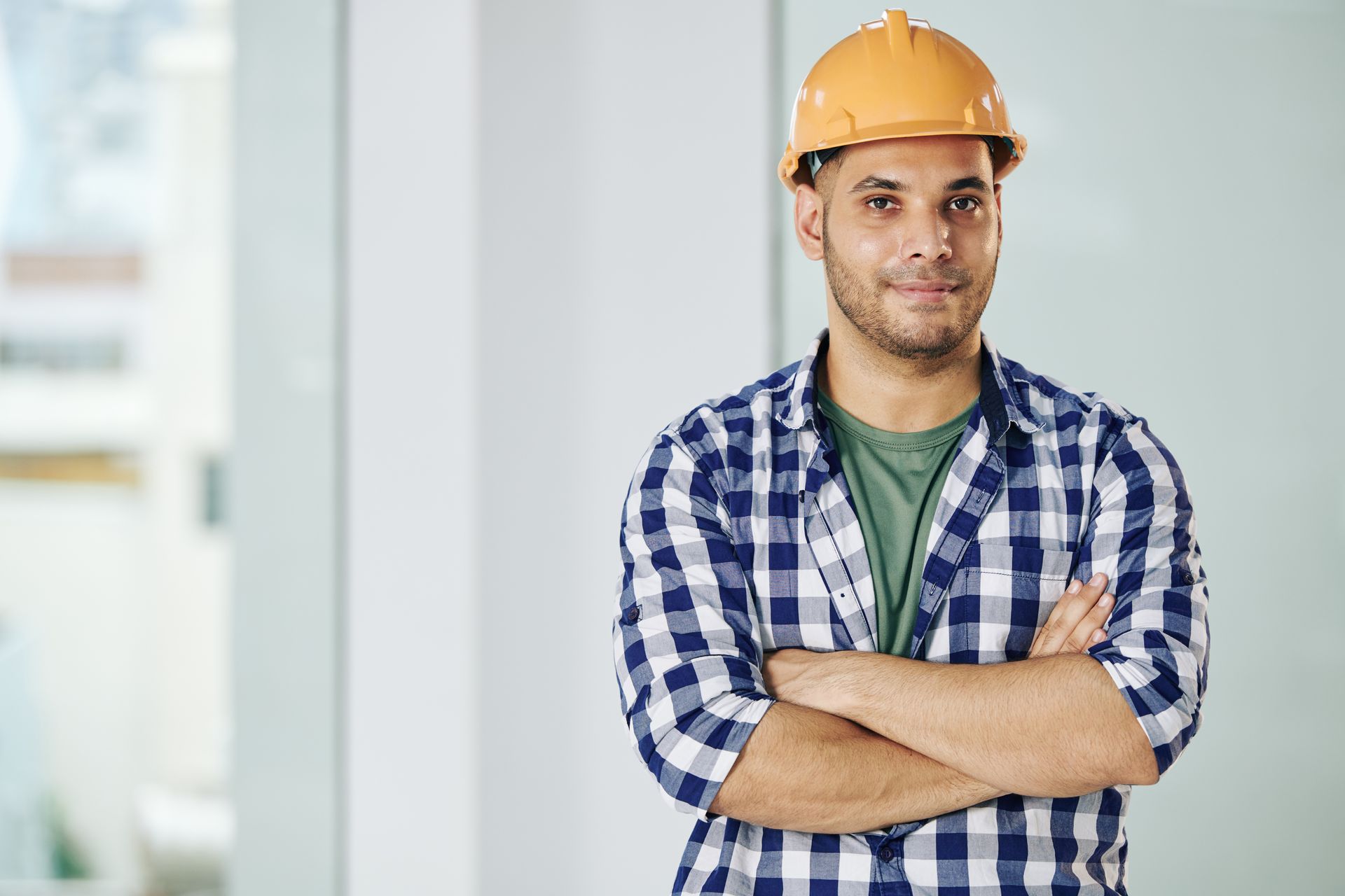 contractor smiling with crossed arms