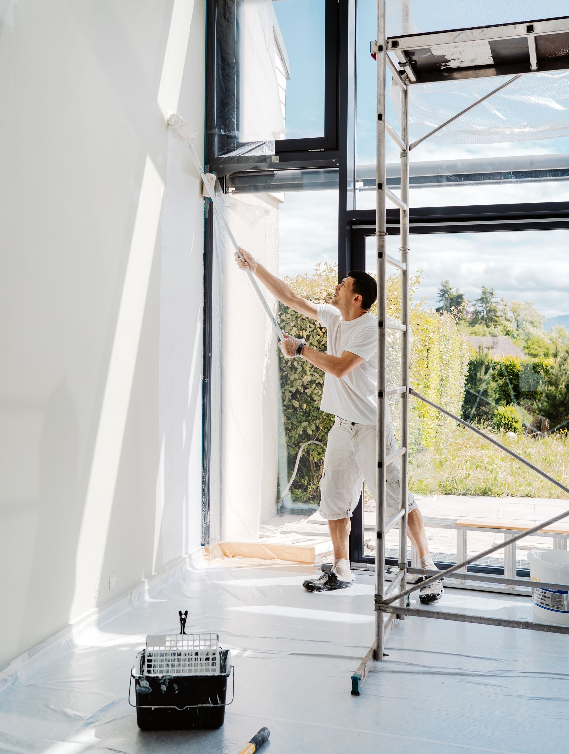 man painting in home
