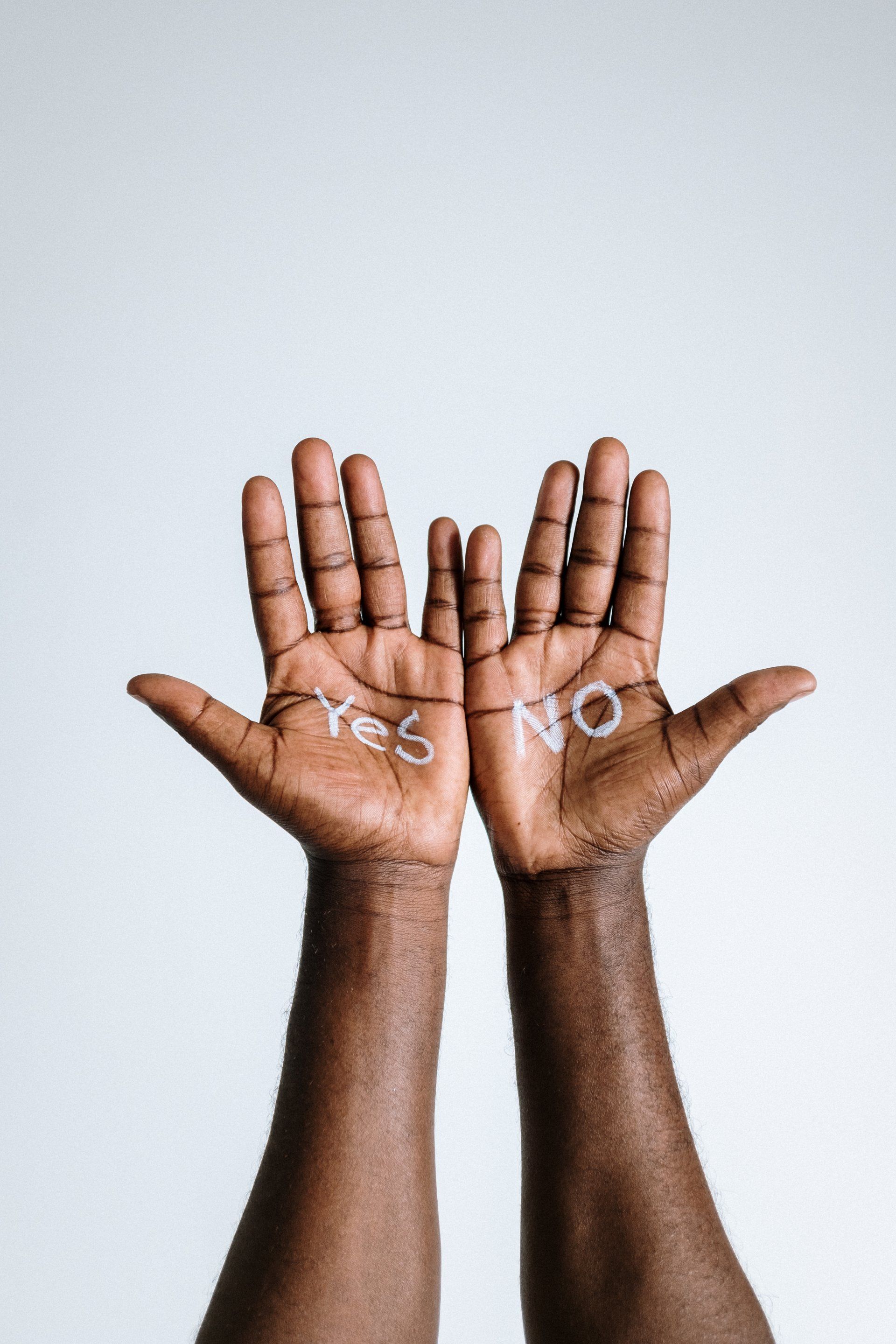 Two dark-skinned hands, palms up, with 