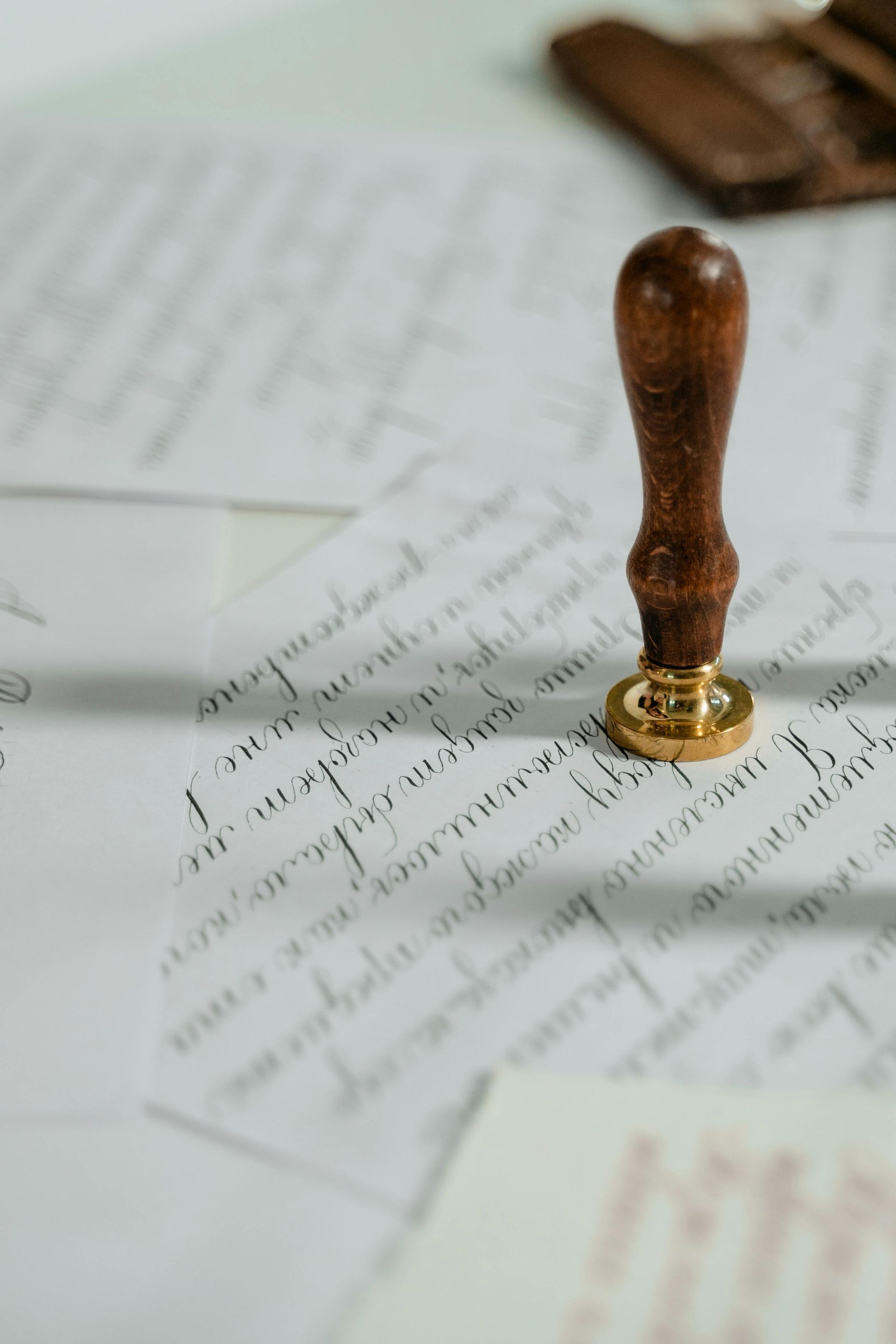 Wax seal stamp on a document with handwritten text.