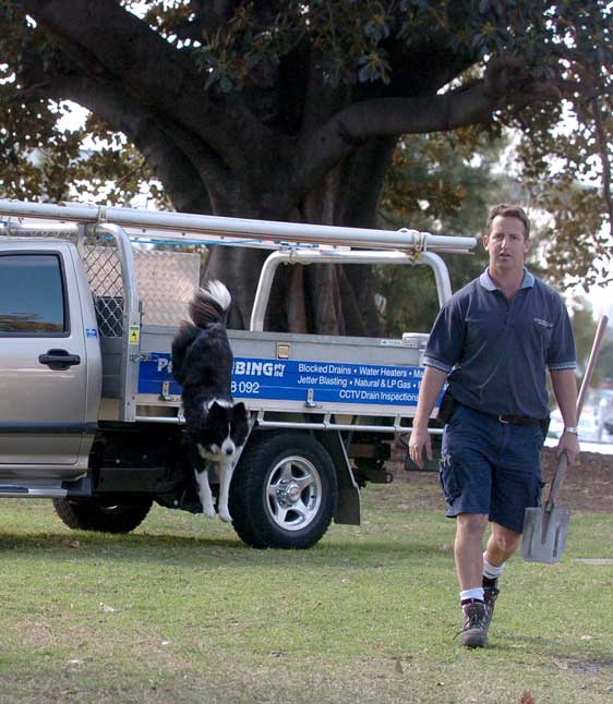 man with shovel walking