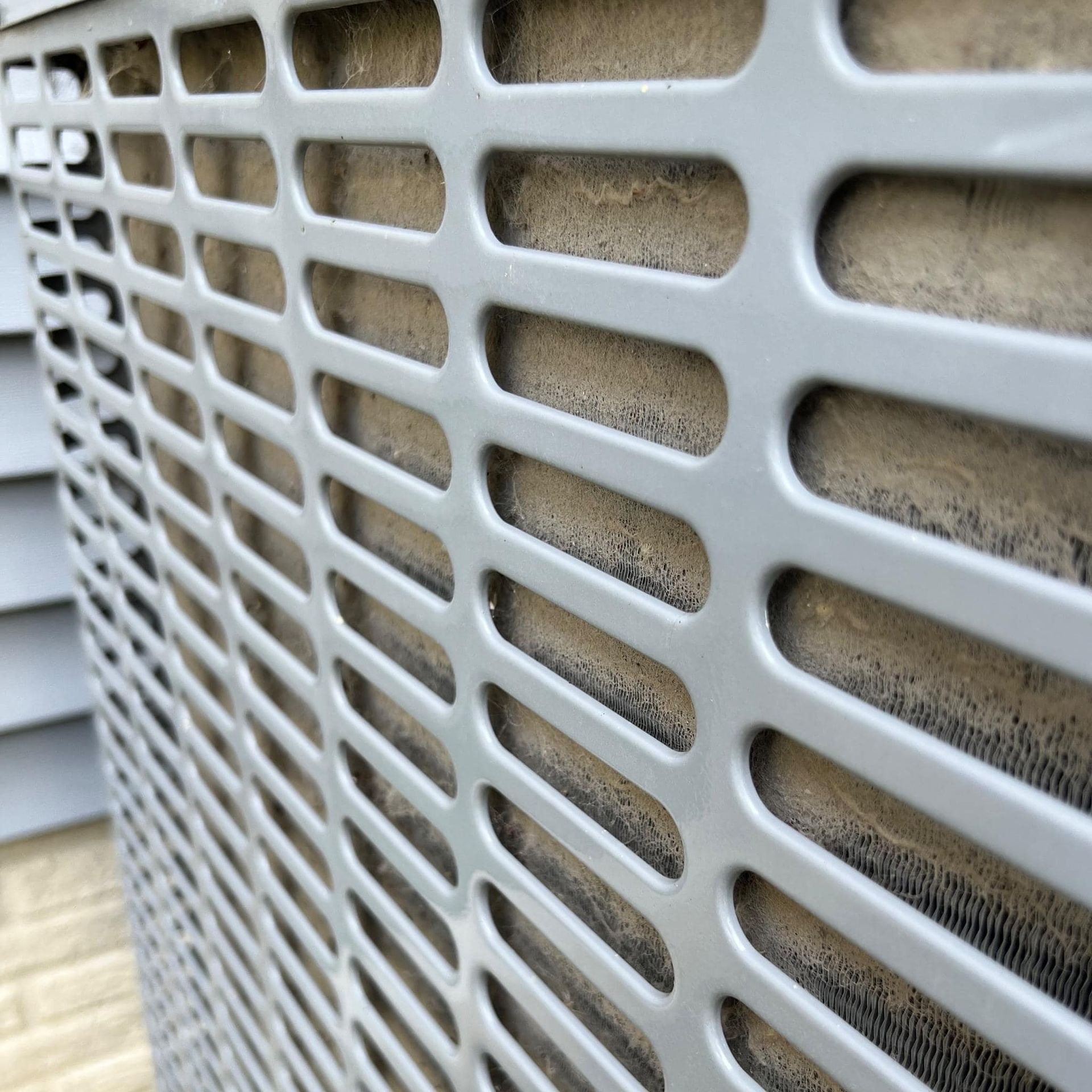A close up of a wall with holes in it