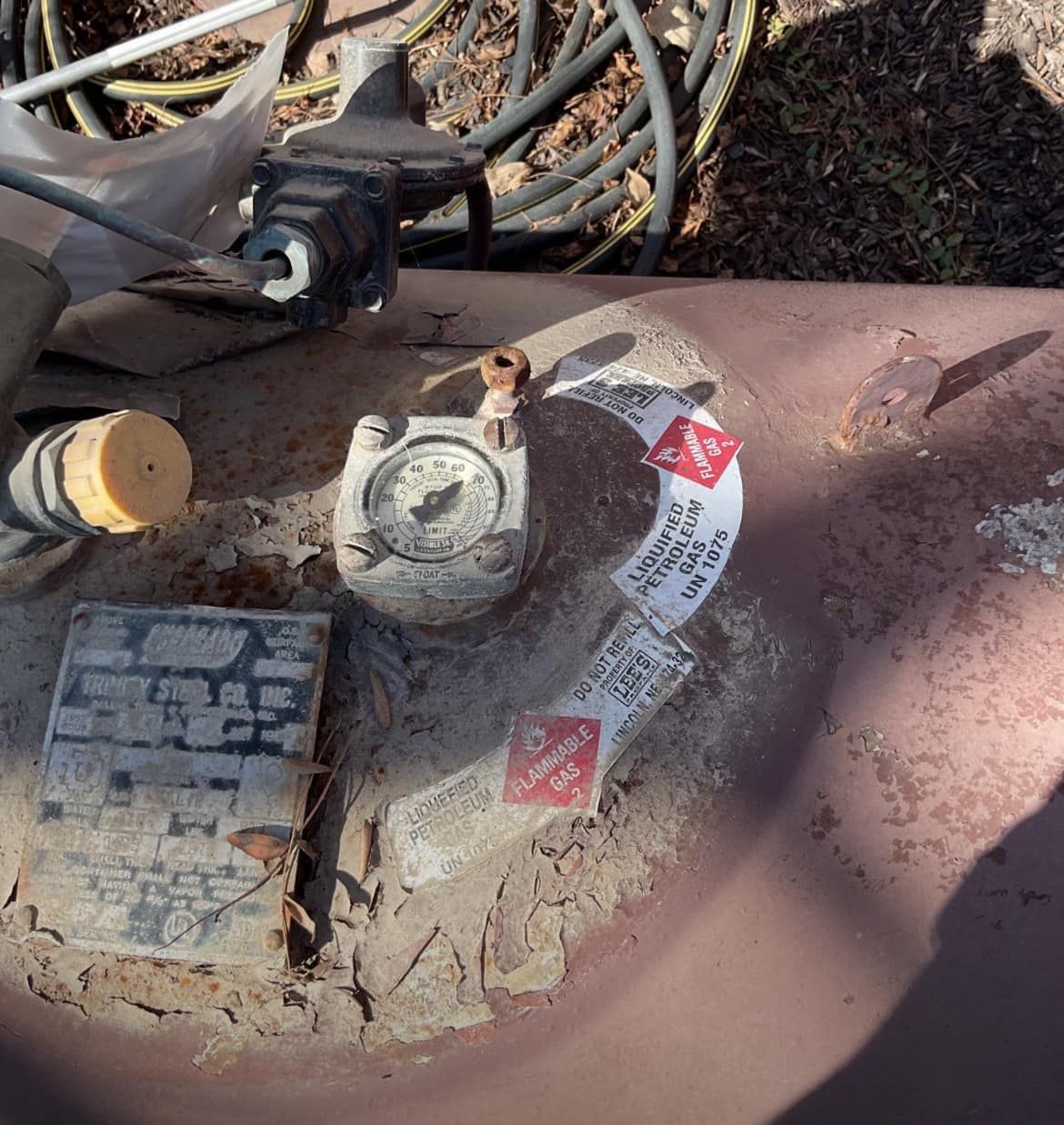 A close up of a gas tank with a sticker on it that says