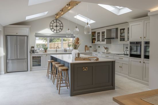 a kitchen with wooden cabinets and a large island