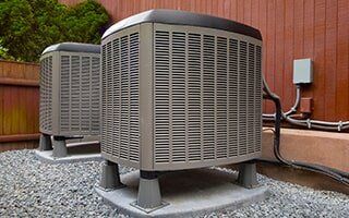 Air Conditioner Maintenance — Air Cconditioning Units Outside The House in Greensburg, PA