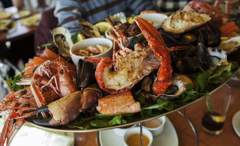 Food near to our properties to buy or rent in the Cayman Islands. Seafood platter: lobster, crab, shrimp, oysters and mussels