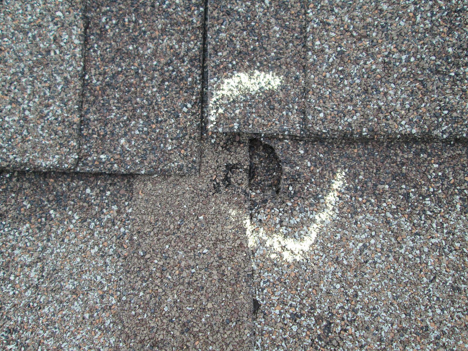 A close up of a roof with a hole in it.